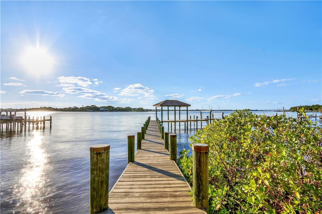 171 South River Road Stuart, FL 34996 - Photo 10 of 68 a view of a balcony with lake view and a floor to ceiling window