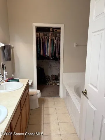 a bathroom with a sink a toilet and bathtub