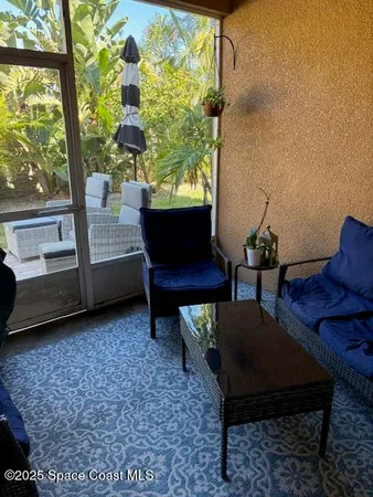a living room with furniture and a window