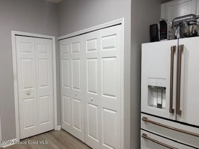 a view of a kitchen from the hallway