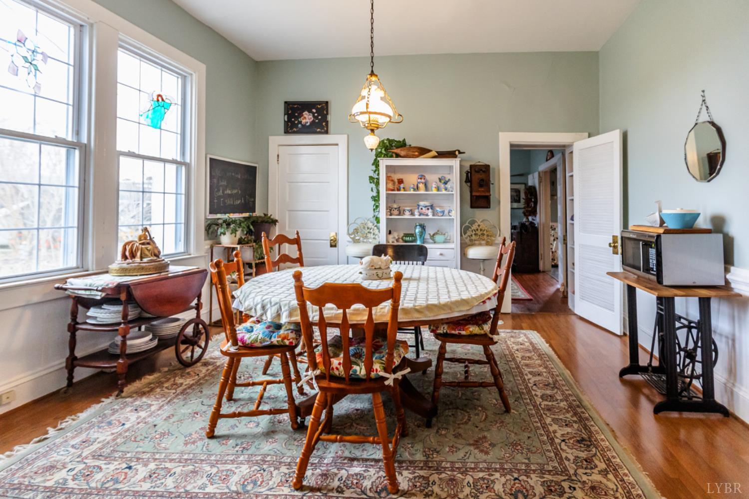801 Purdum Mill Road Appomattox, VA 24522 - Photo 11 of 68 a dining room with furniture window and wooden floor