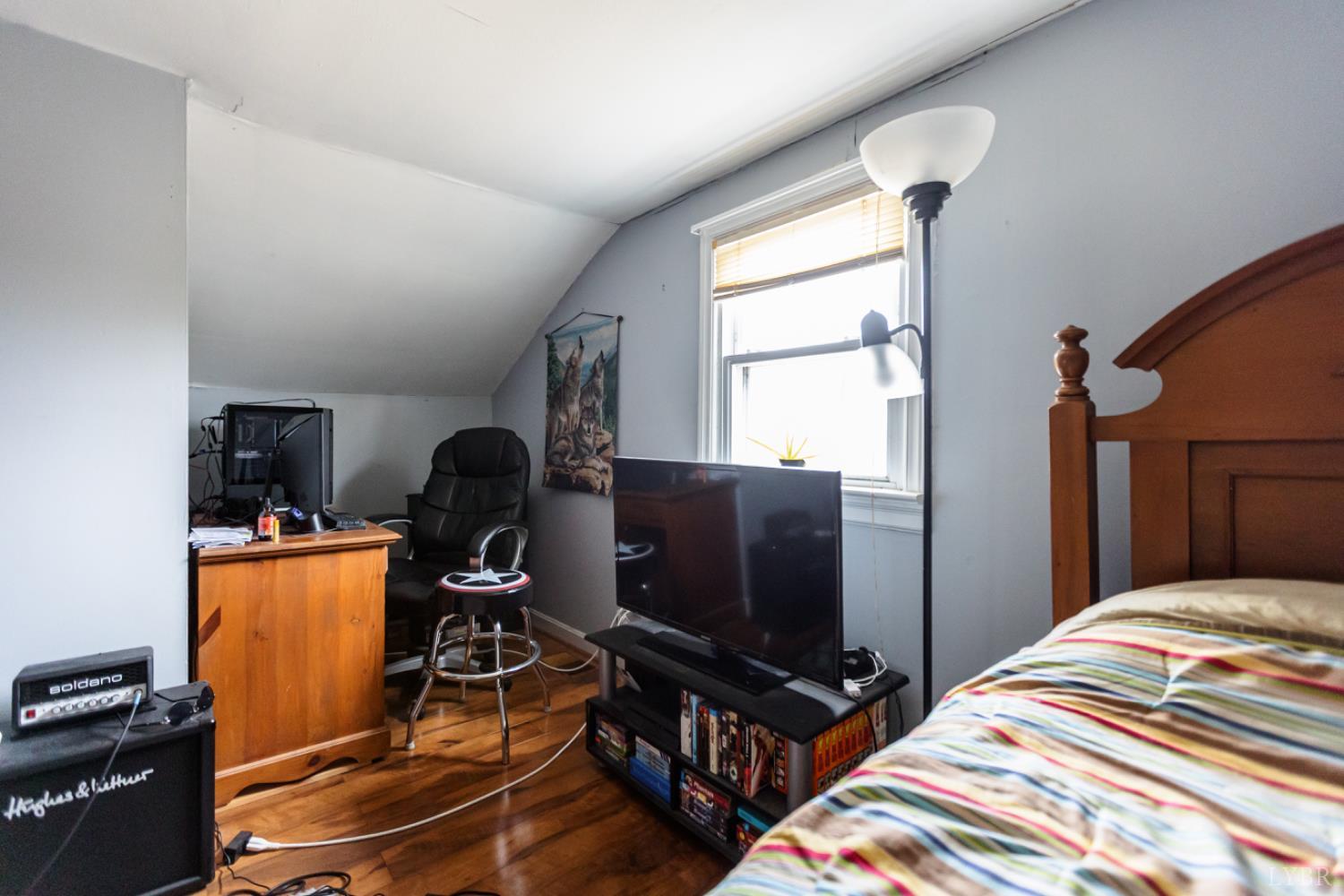 801 Purdum Mill Road Appomattox, VA 24522 - Photo 16 of 68 a bedroom with workspace and a window