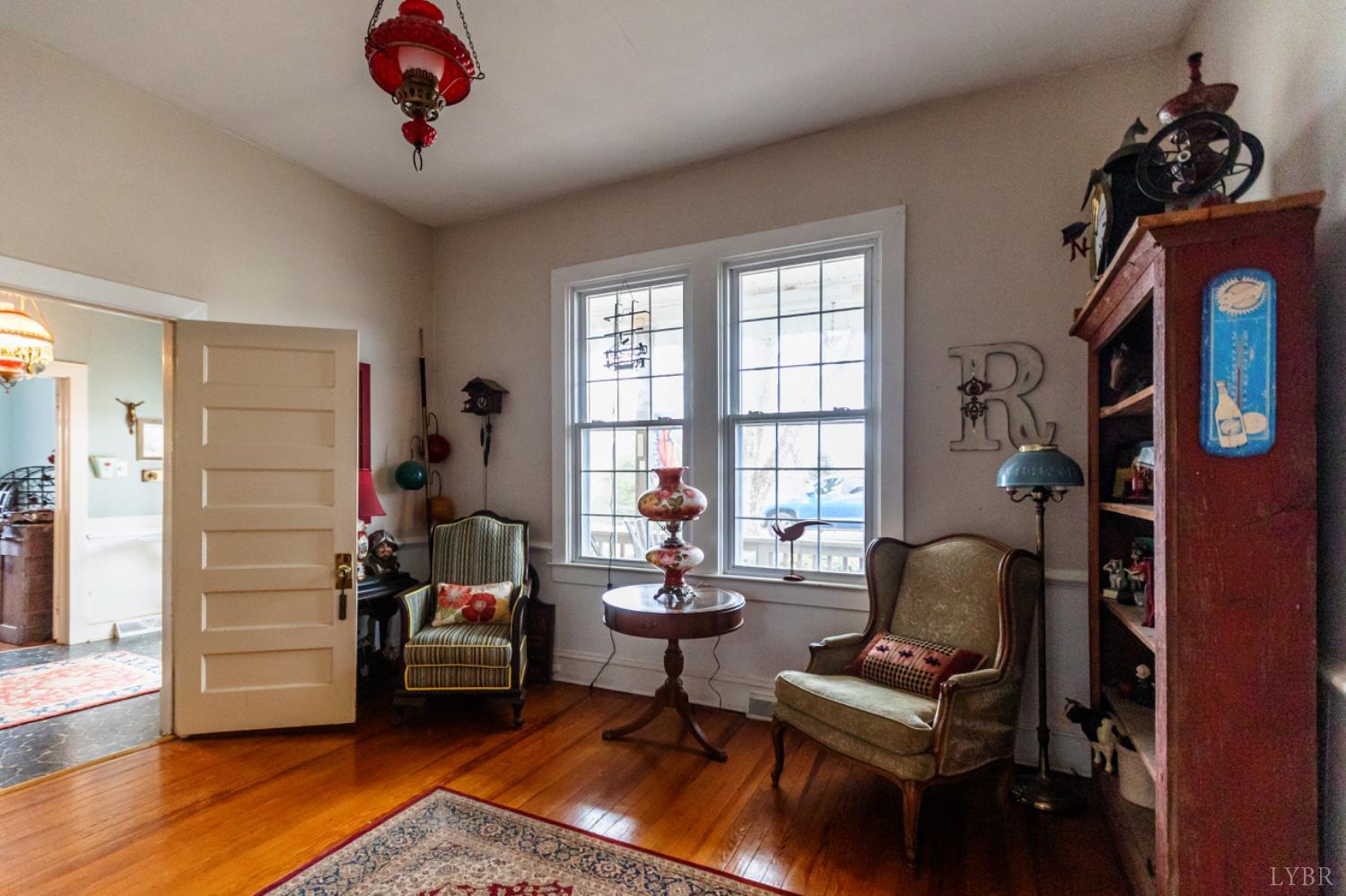 801 Purdum Mill Road Appomattox, VA 24522 - Photo 23 of 68 a living room with furniture a rug and a window