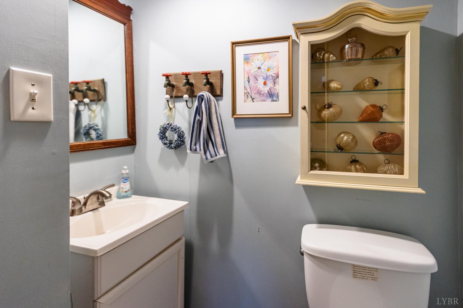 801 Purdum Mill Road Appomattox, VA 24522 - Photo 28 of 68 a bathroom with a toilet sink and mirror