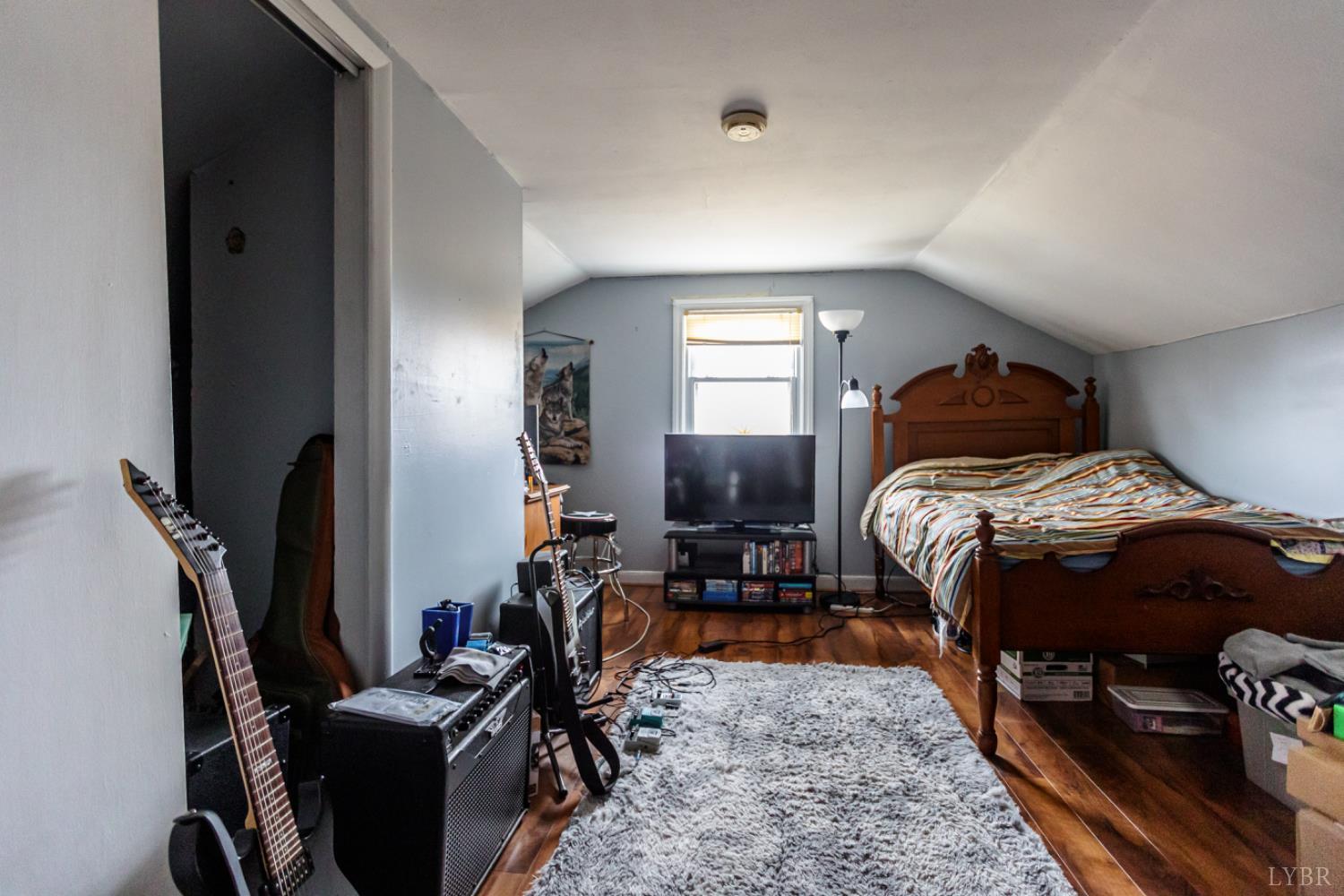 801 Purdum Mill Road Appomattox, VA 24522 - Photo 32 of 68 a bedroom with a bed and wooden floor