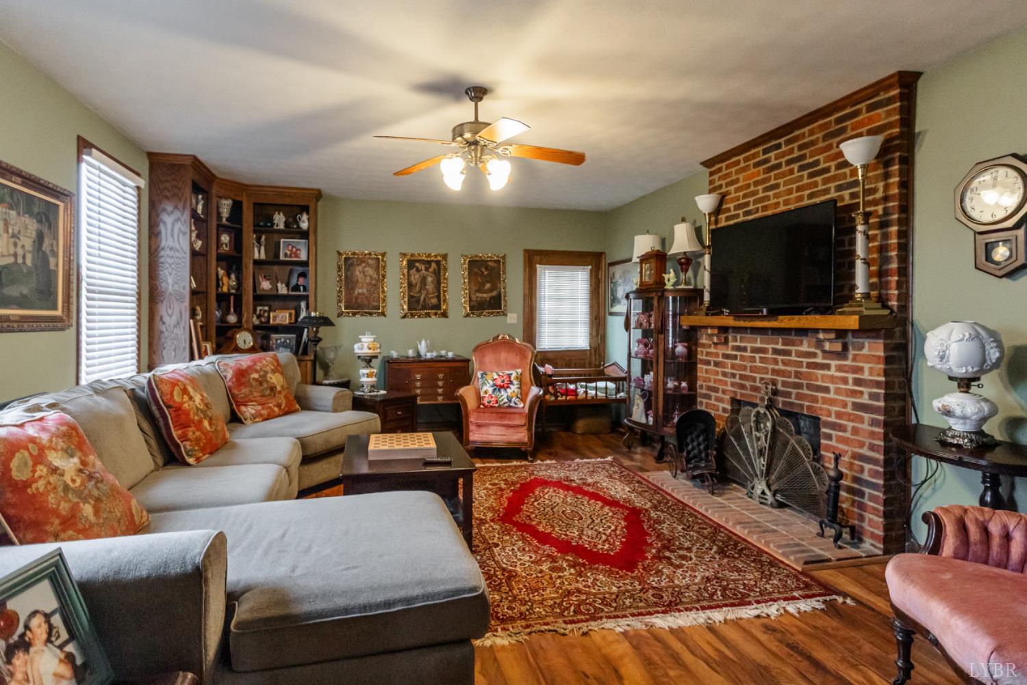 801 Purdum Mill Road Appomattox, VA 24522 - Photo 40 of 68 a living room with fireplace furniture and a flat screen tv