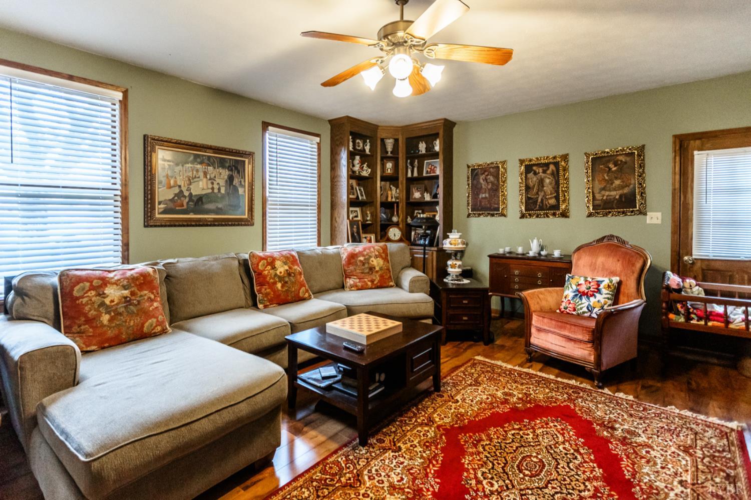 801 Purdum Mill Road Appomattox, VA 24522 - Photo 42 of 68 a living room with furniture a couch and two window