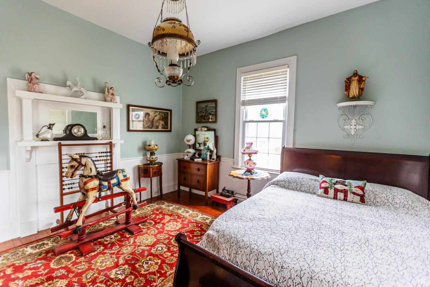 801 Purdum Mill Road Appomattox, VA 24522 - Photo 8 of 68 a bedroom with bed and a chandelier