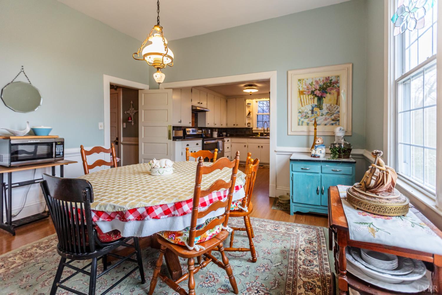 801 Purdum Mill Road Appomattox, VA 24522 - Photo 10 of 68 a dining room with furniture a rug and a chandelier