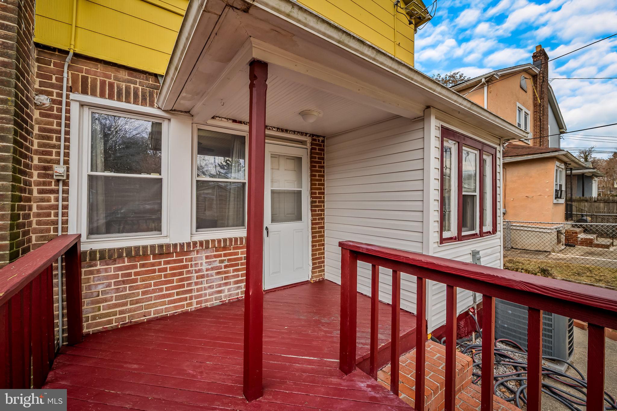 2908 East Cold Spring Lane Baltimore, MD 21214 - Photo 16 of 19 a view of a brick house with large windows