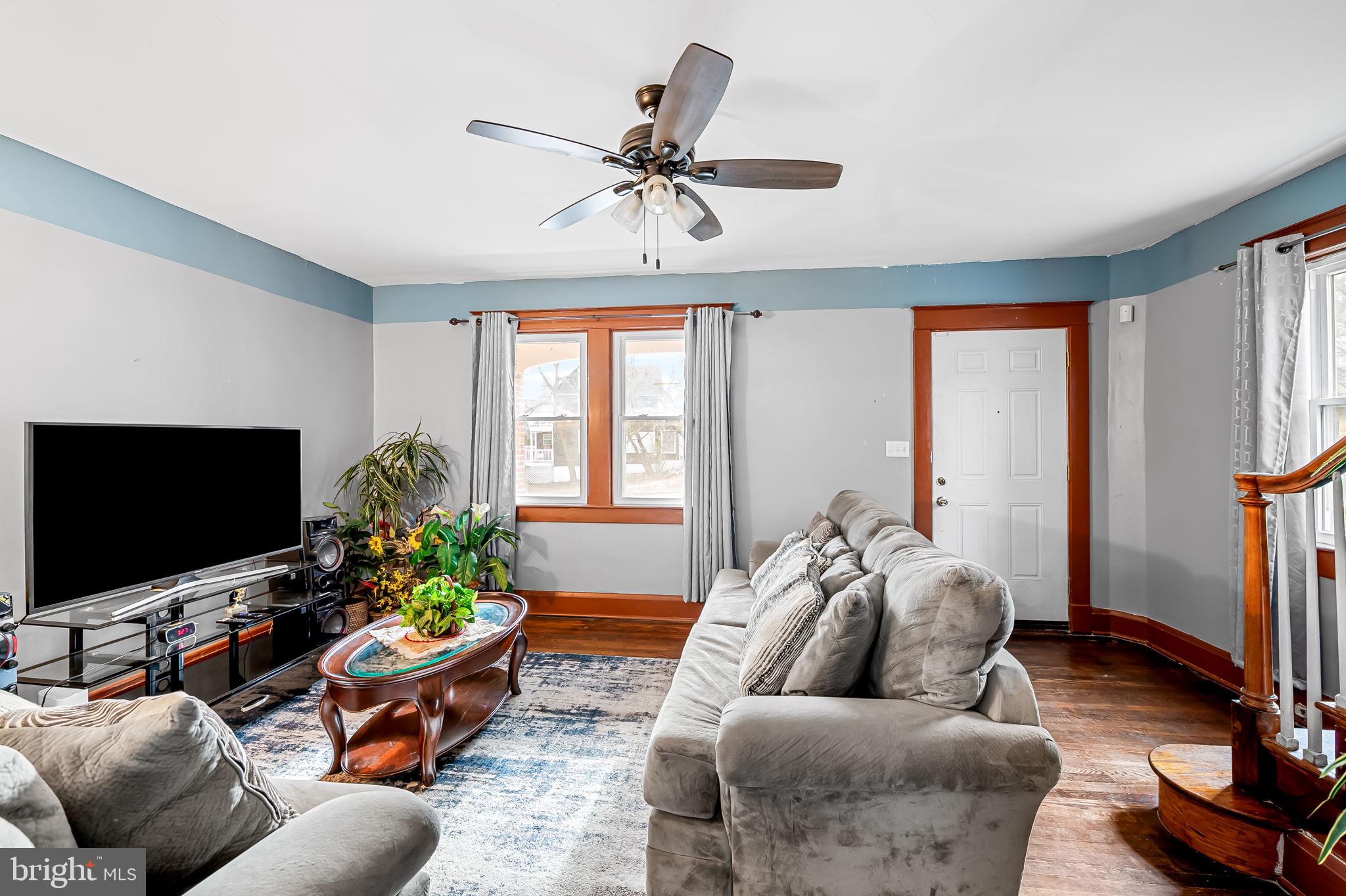 2908 East Cold Spring Lane Baltimore, MD 21214 - Photo 3 of 19 a living room with furniture and a flat screen tv