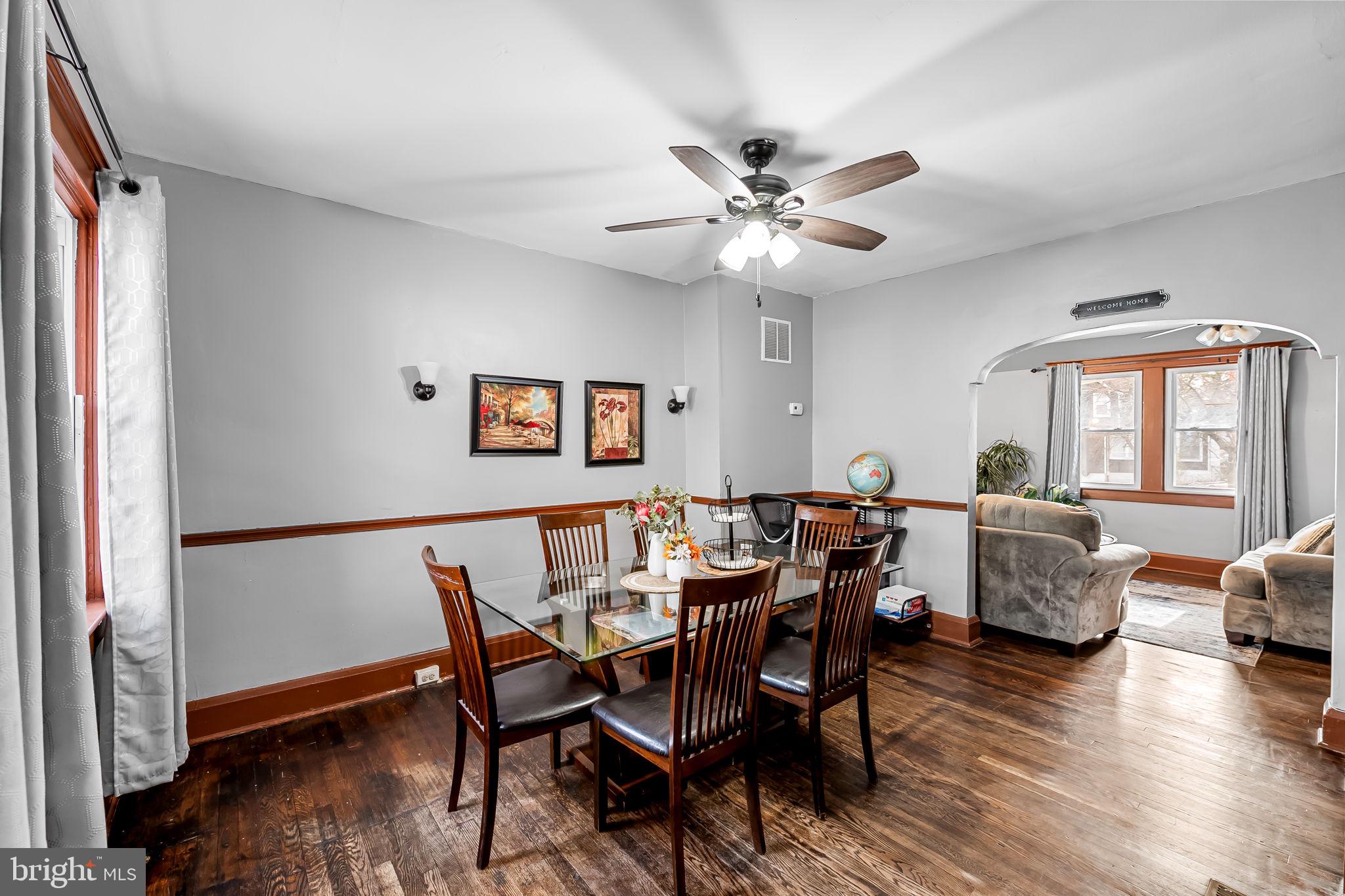2908 East Cold Spring Lane Baltimore, MD 21214 - Photo 4 of 19 a view of a dining room with furniture and wooden floor