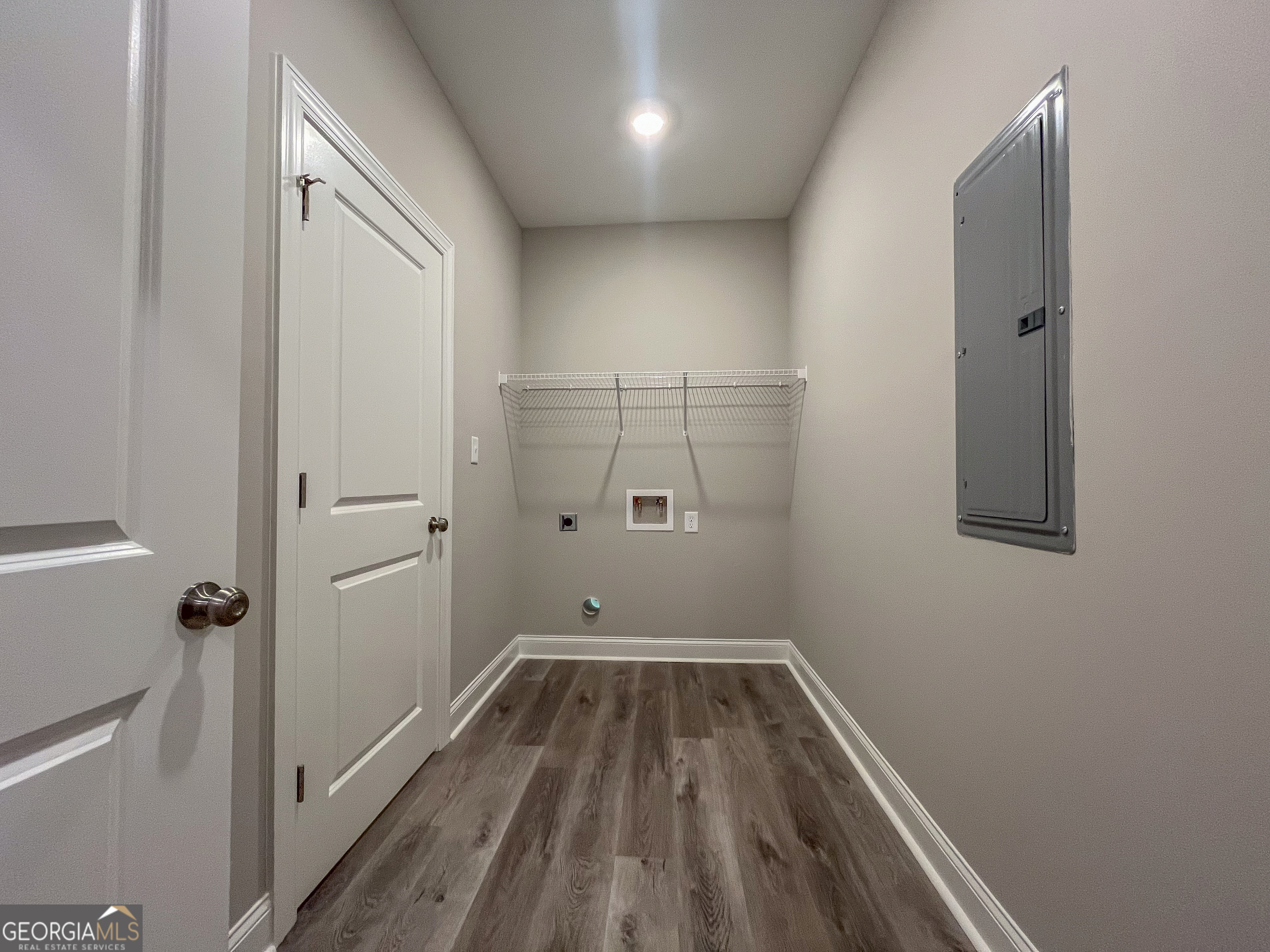 711 Flanders Lane Dublin, GA 31021 - Photo 18 of 49 a view of a room with wooden floor and white walls