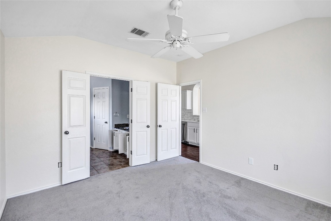 17616 Strontian Pass Pflugerville, TX 78660 - Photo 19 of 20 a view of a room with a ceiling fan and closet area