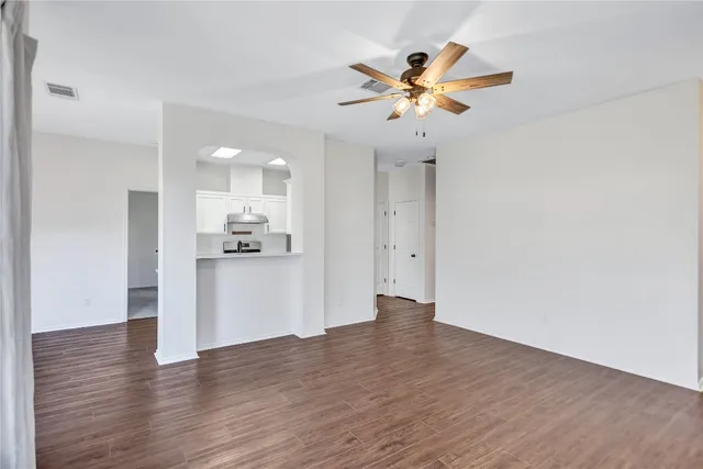 a view of a kitchen with wooden floor and a kitchen
