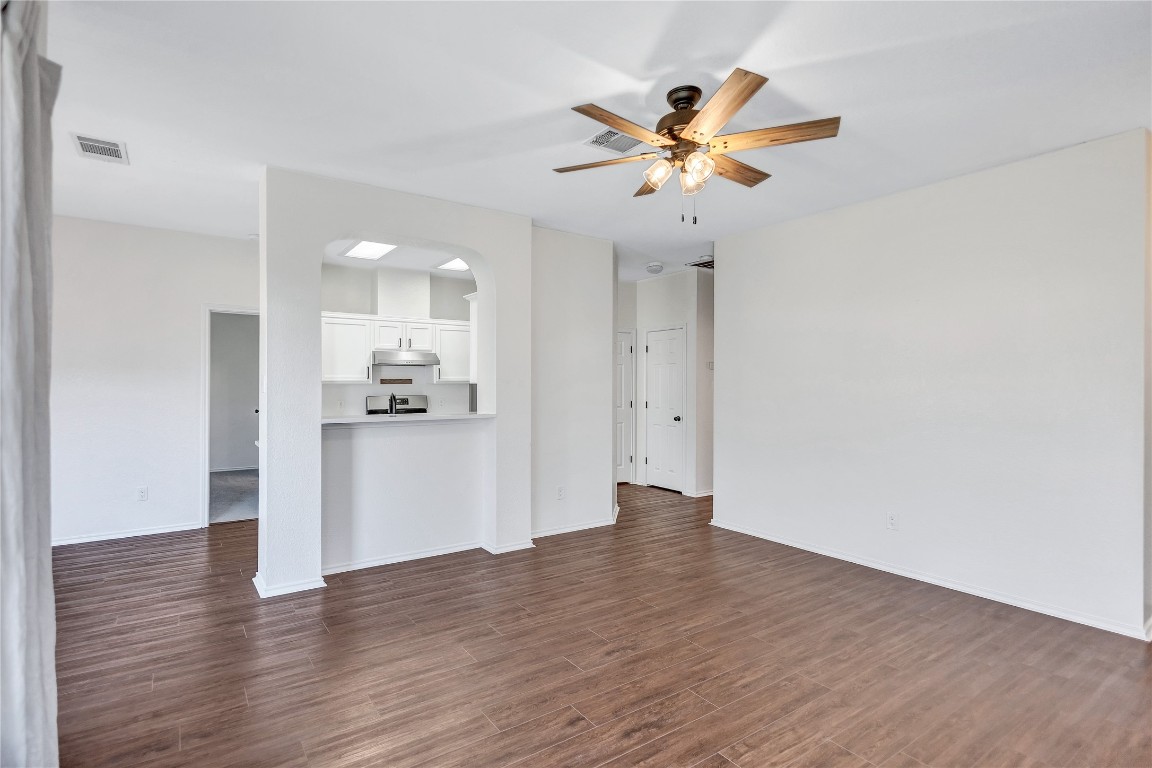 17616 Strontian Pass Pflugerville, TX 78660 - Photo 4 of 20 a view of a kitchen with wooden floor and a kitchen