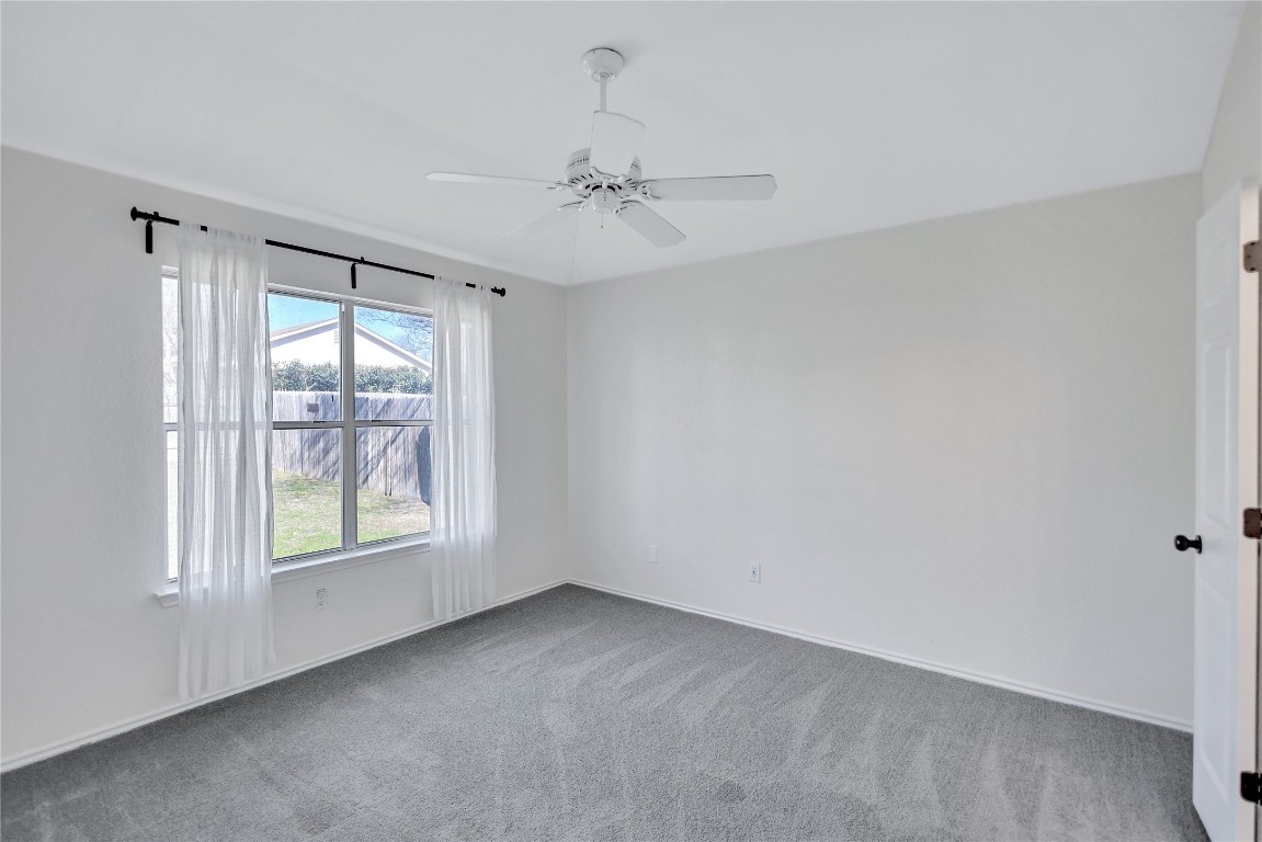 17616 Strontian Pass Pflugerville, TX 78660 - Photo 10 of 20 wooden floor in an empty room with a window