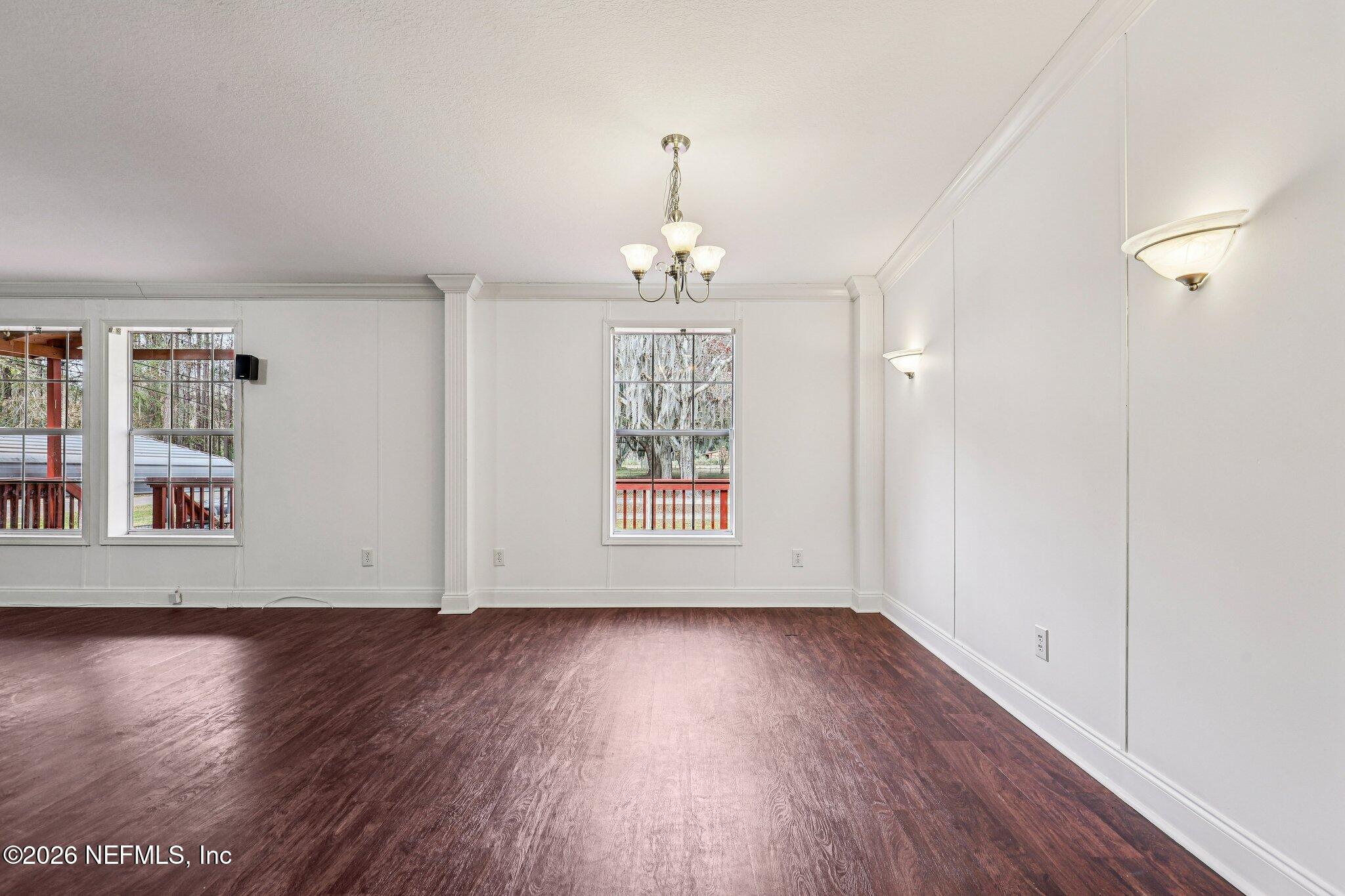 13725 Webb Road Jacksonville, FL 32218 - Photo 14 of 61 wooden floor in an empty room with a window
