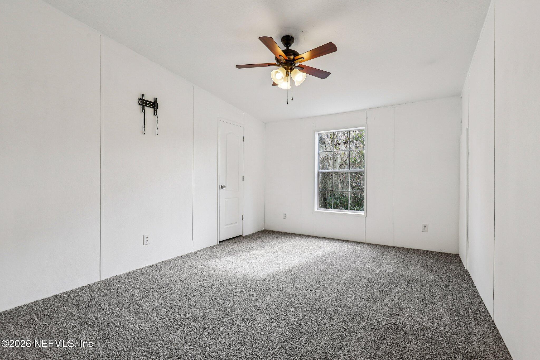 13725 Webb Road Jacksonville, FL 32218 - Photo 32 of 61 a view of an empty room with a window