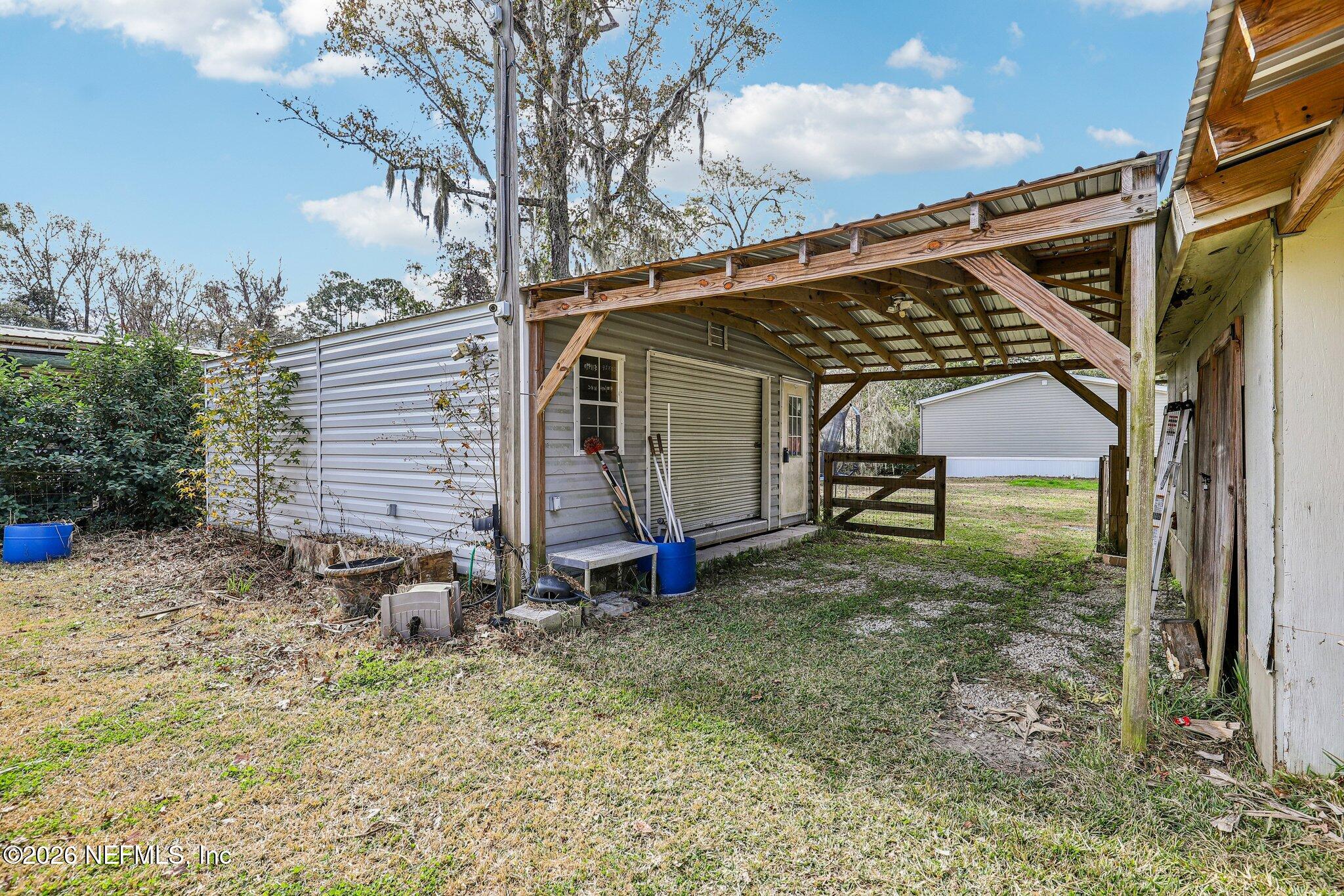 13725 Webb Road Jacksonville, FL 32218 - Photo 38 of 61 a view of a house with backyard