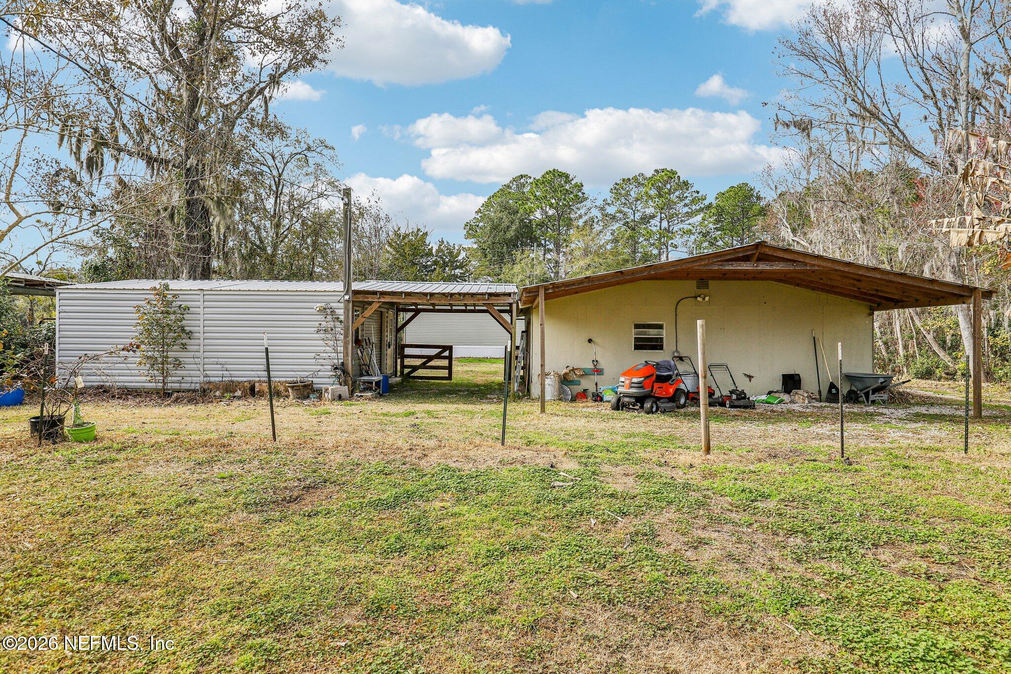 13725 Webb Road Jacksonville, FL 32218 - Photo 39 of 61 a view of a house with basketball court
