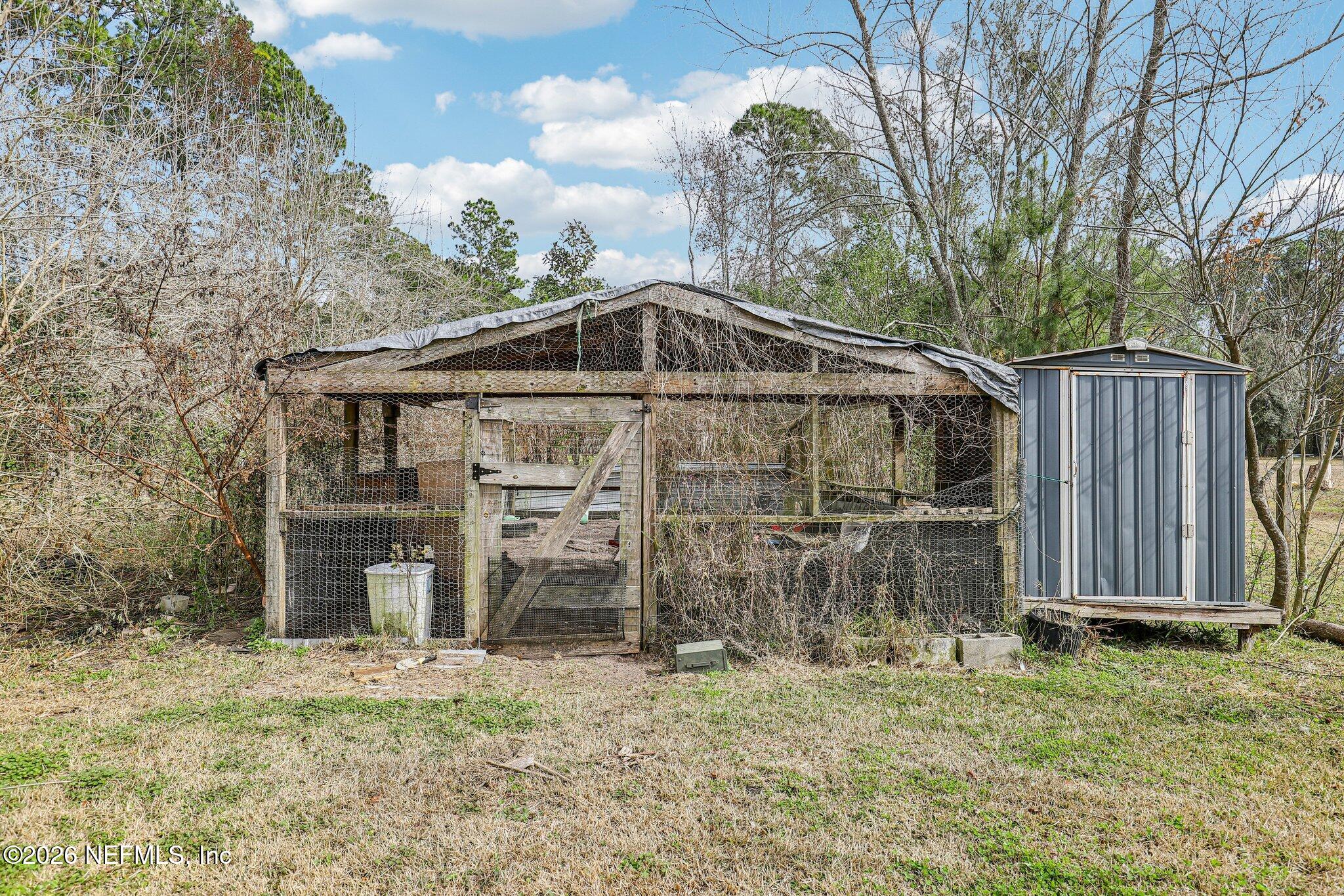 13725 Webb Road Jacksonville, FL 32218 - Photo 40 of 61 a front view of a house with garden