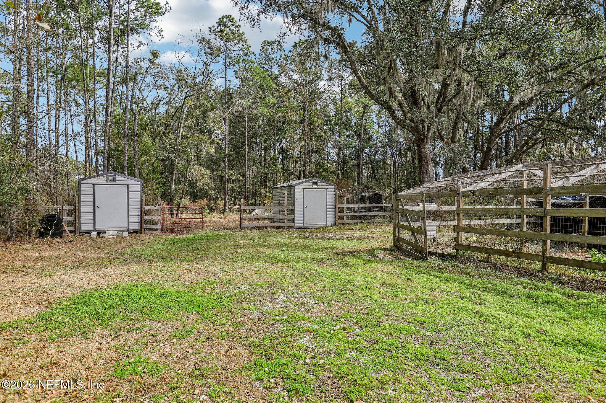 13725 Webb Road Jacksonville, FL 32218 - Photo 44 of 61 a view of a tiny house with a yard