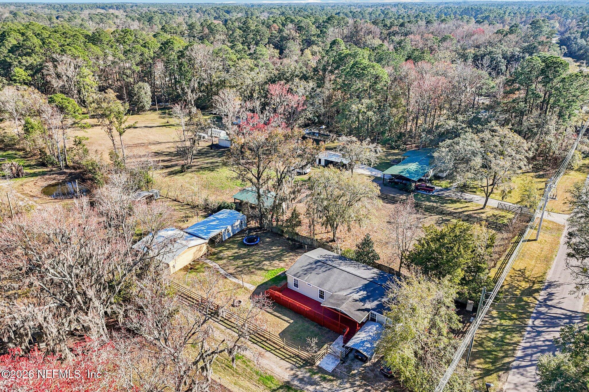 13725 Webb Road Jacksonville, FL 32218 - Photo 45 of 61 a view of swimming pool with a yard and lake view