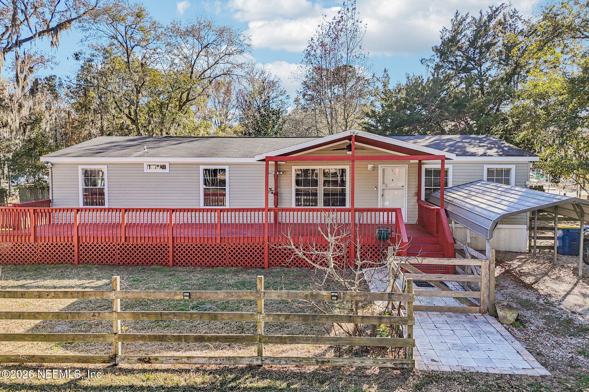 13725 Webb Road Jacksonville, FL 32218 - Photo 47 of 61 a front view of a house with garden