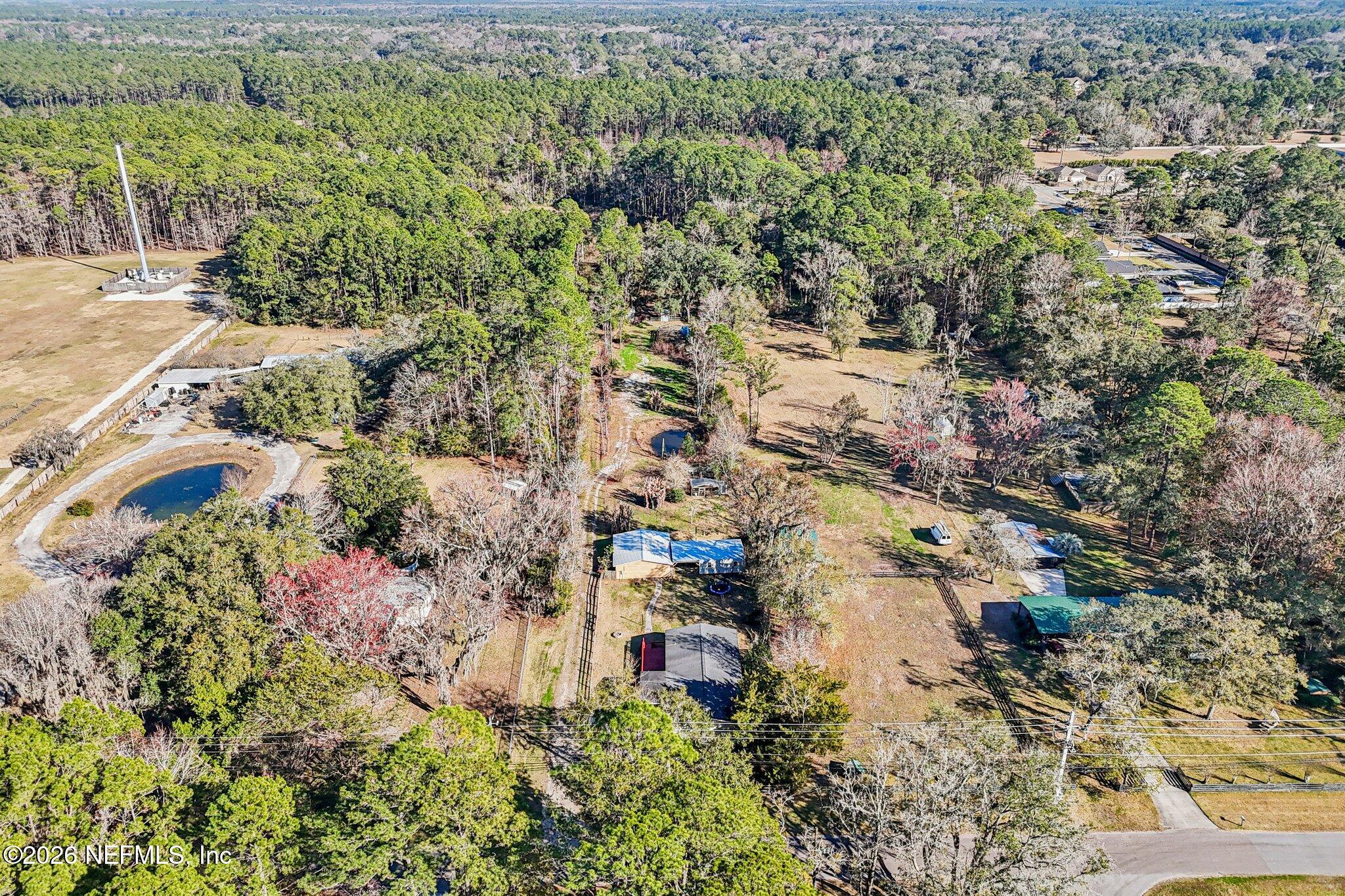 13725 Webb Road Jacksonville, FL 32218 - Photo 49 of 61 an aerial view of residential house with parking space