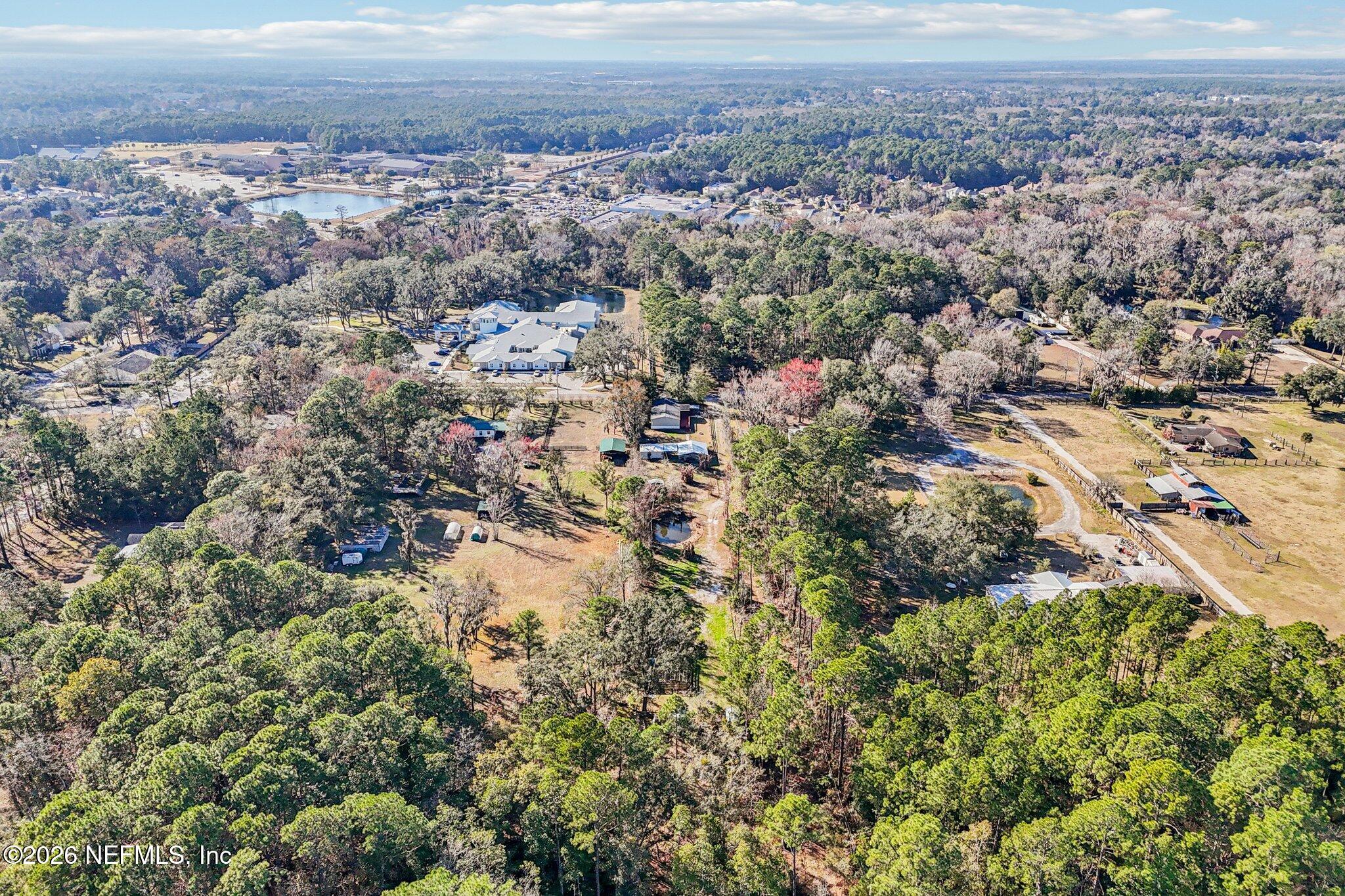 13725 Webb Road Jacksonville, FL 32218 - Photo 52 of 61 an aerial view of residential house and covered with trees
