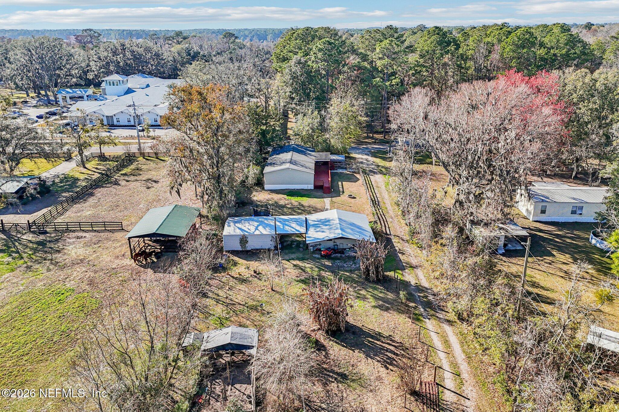 13725 Webb Road Jacksonville, FL 32218 - Photo 58 of 61 a view of houses with yard