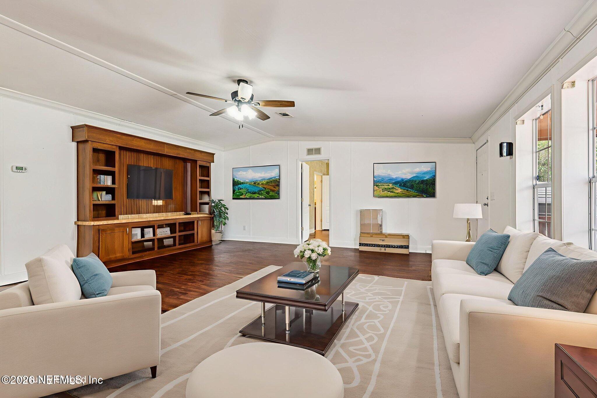 13725 Webb Road Jacksonville, FL 32218 - Photo 7 of 61 a living room with furniture a ceiling fan and a window