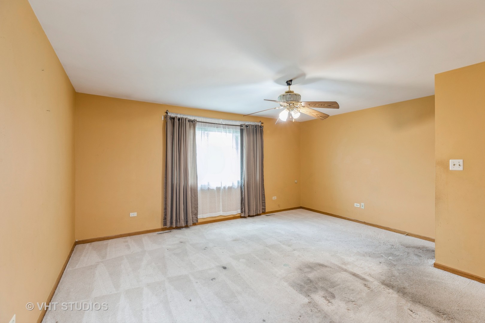 438 Tamarack Street Park Forest, IL 60466 - Photo 20 of 25 an empty room with a chandelier fan and windows