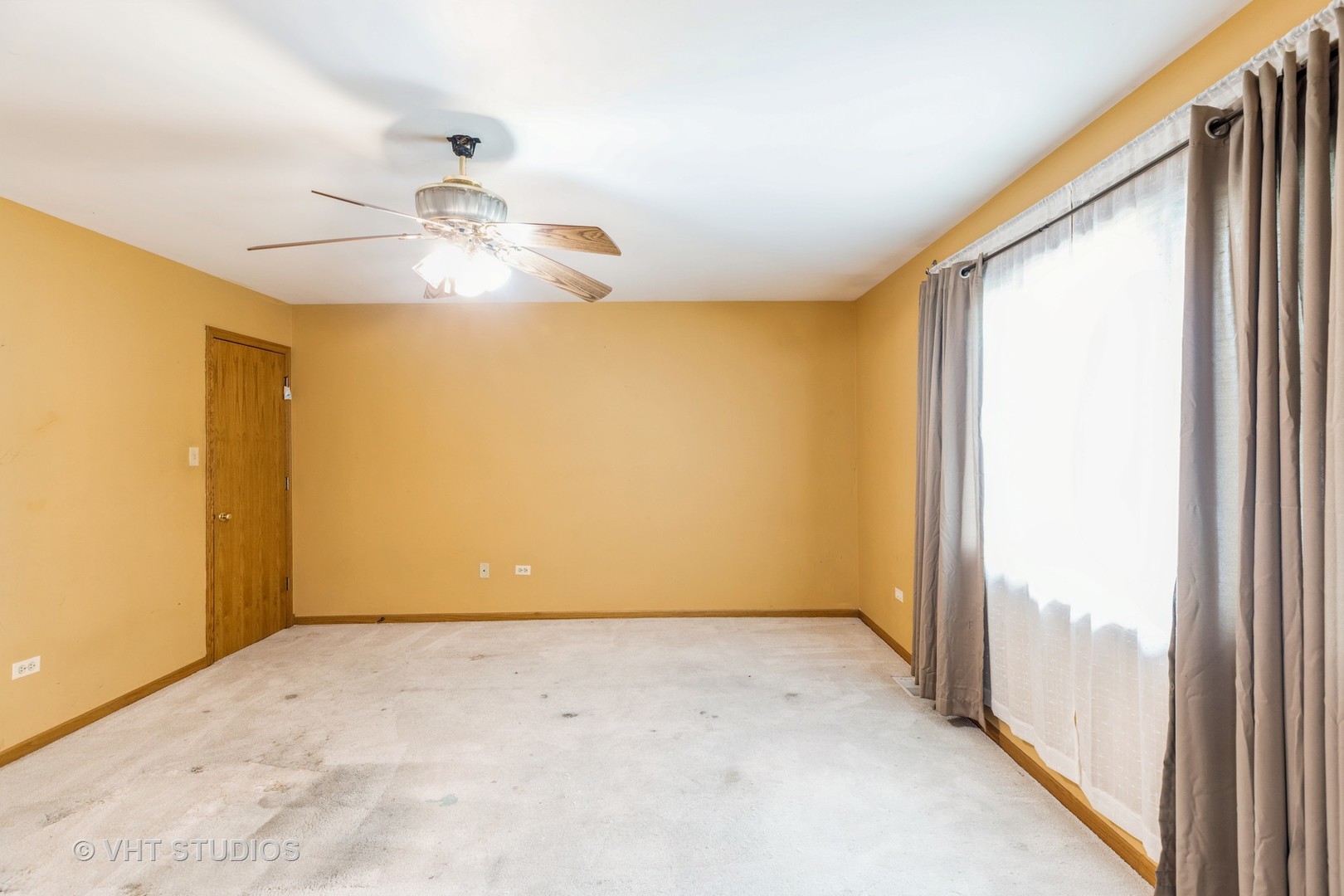 438 Tamarack Street Park Forest, IL 60466 - Photo 21 of 25 a view of a big room with chandelier fan and windows
