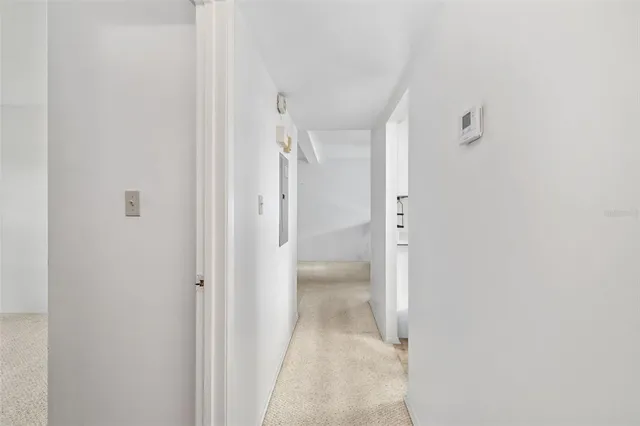 a bed sitting in a room next to a window