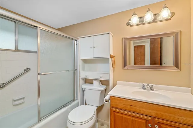 a bathroom with a glass shower door