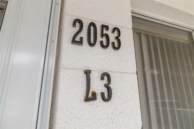 an aerial view of a city with swimming pool outdoor seating and yard