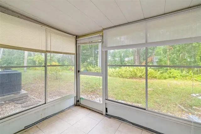 a view of an empty room and window