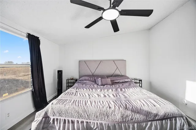 a bedroom with a bed and window