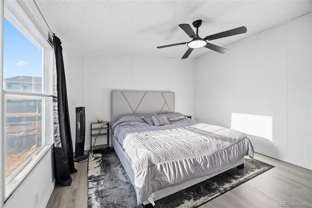 a bedroom with a bed and window