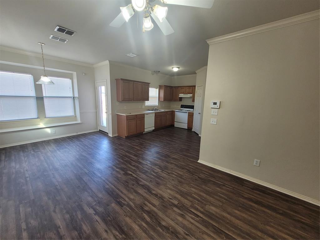 244 Wyndham Meadows Way Wylie, TX 75098 - Photo 2 of 12 a view of a kitchen with wooden floor and electronic appliances