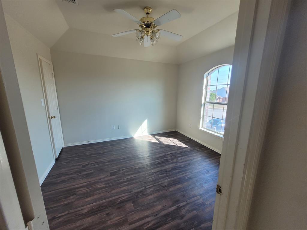 244 Wyndham Meadows Way Wylie, TX 75098 - Photo 5 of 12 wooden floor in an empty room with a window