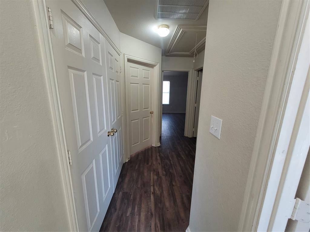 244 Wyndham Meadows Way Wylie, TX 75098 - Photo 6 of 12 a view of a hallway with wooden floor