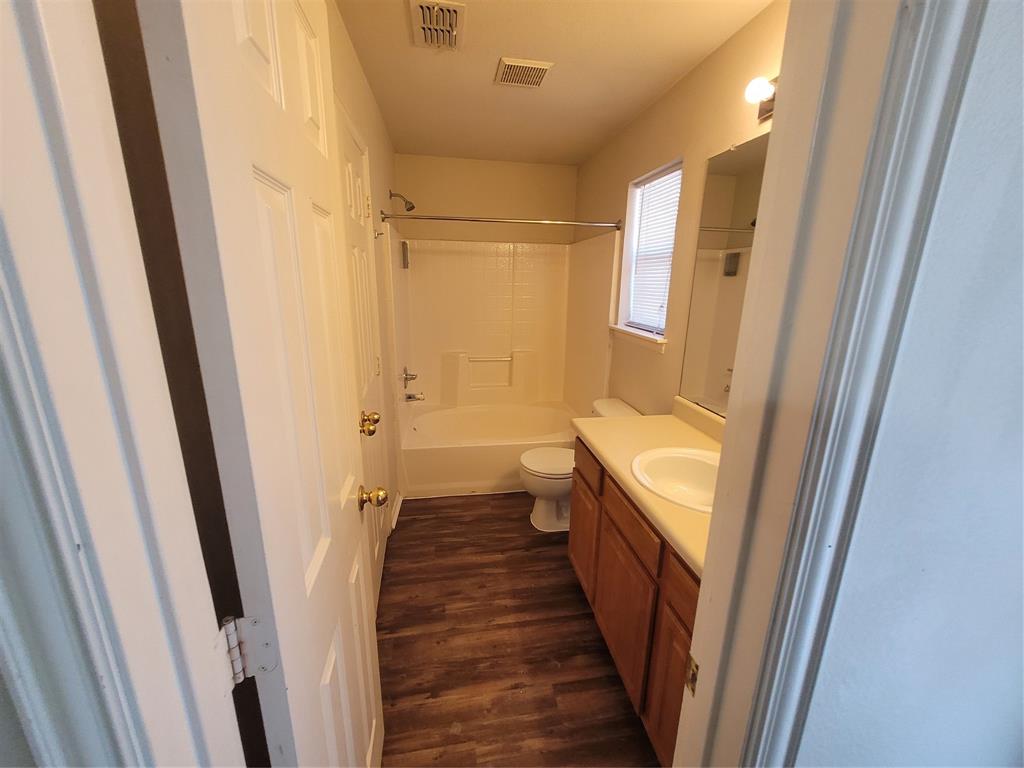 244 Wyndham Meadows Way Wylie, TX 75098 - Photo 9 of 12 a bathroom with sink a toilet a sink and vanity