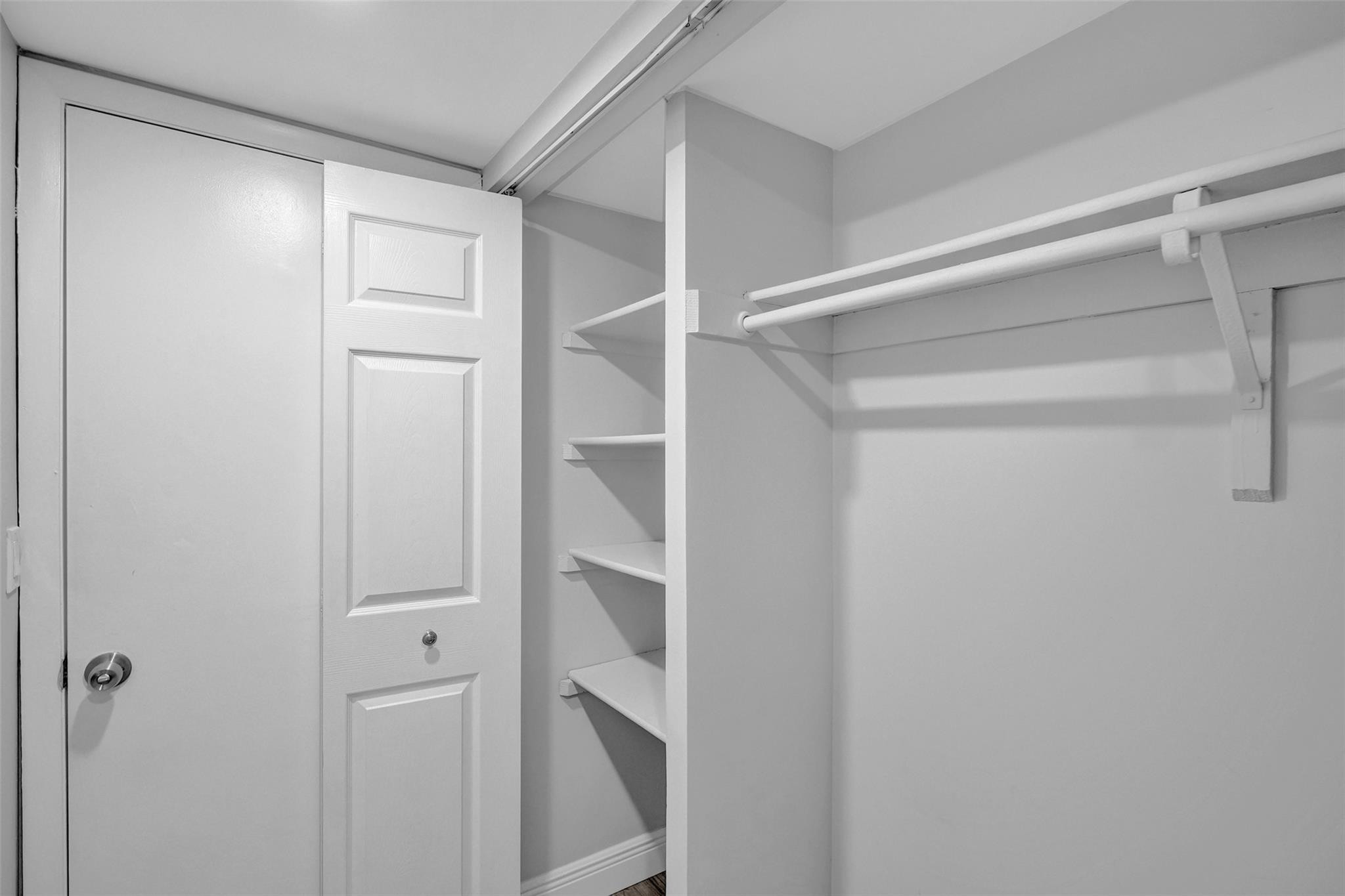 3100 Riverside Drive, Unit 109 Coral Springs, FL 33065 - Photo 14 of 28 a view of walk in closet with empty racks