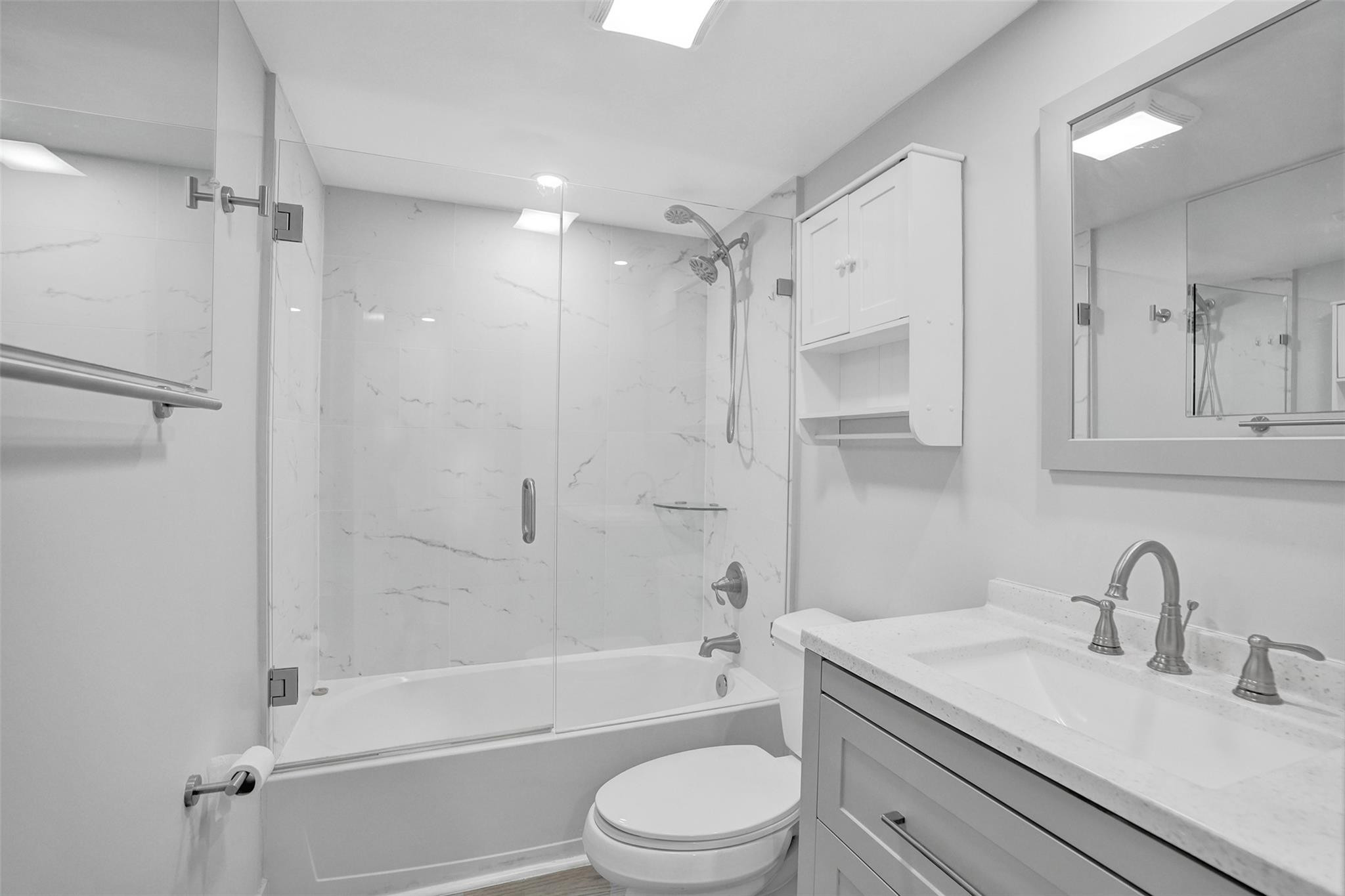 3100 Riverside Drive, Unit 109 Coral Springs, FL 33065 - Photo 17 of 28 a bathroom with a sink toilet tub and shower