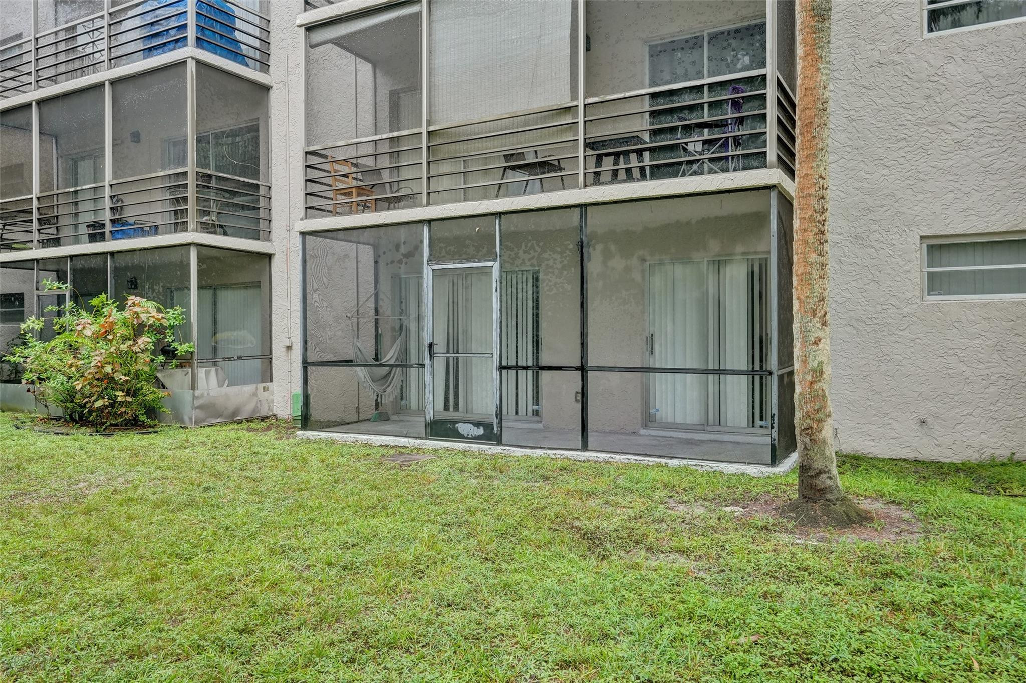 3100 Riverside Drive, Unit 109 Coral Springs, FL 33065 - Photo 23 of 28 a backyard of a house