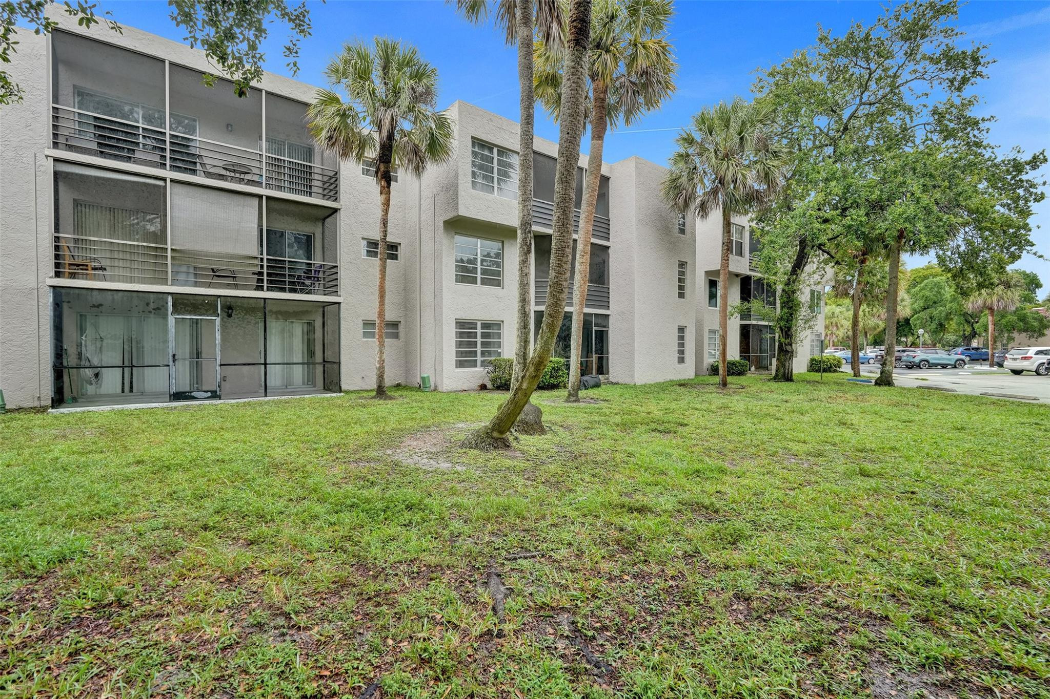 3100 Riverside Drive, Unit 109 Coral Springs, FL 33065 - Photo 24 of 28 a view of a garden with a house