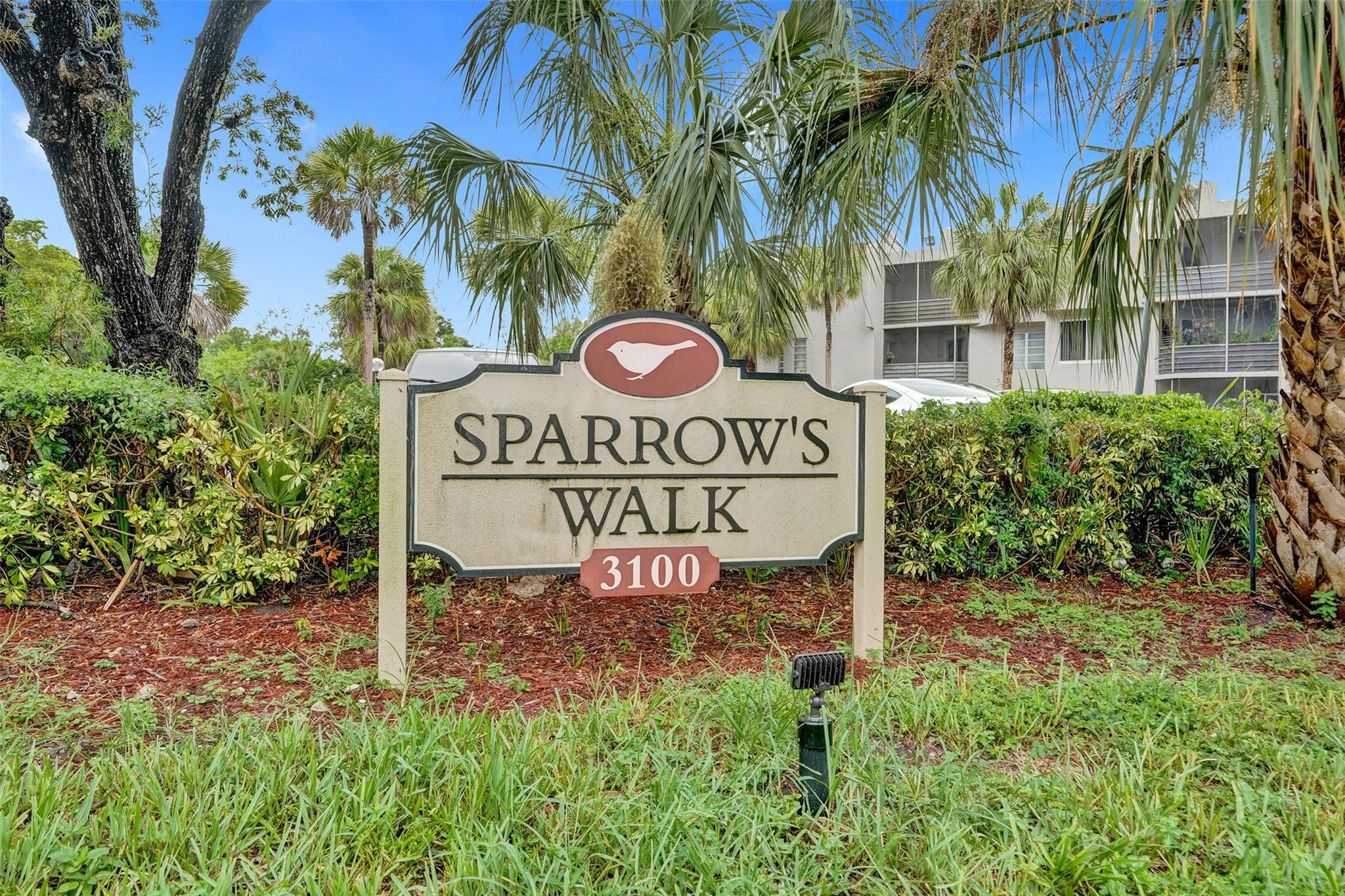 3100 Riverside Drive, Unit 109 Coral Springs, FL 33065 - Photo 28 of 28 a view of sign board with tall trees